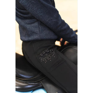 Equipage Kinder Winterreitleggins Sophia in Schwarz mit Glitzer-Details, ideal für junge Reiter im Winter 2026, sitzt bequem im Sattel.